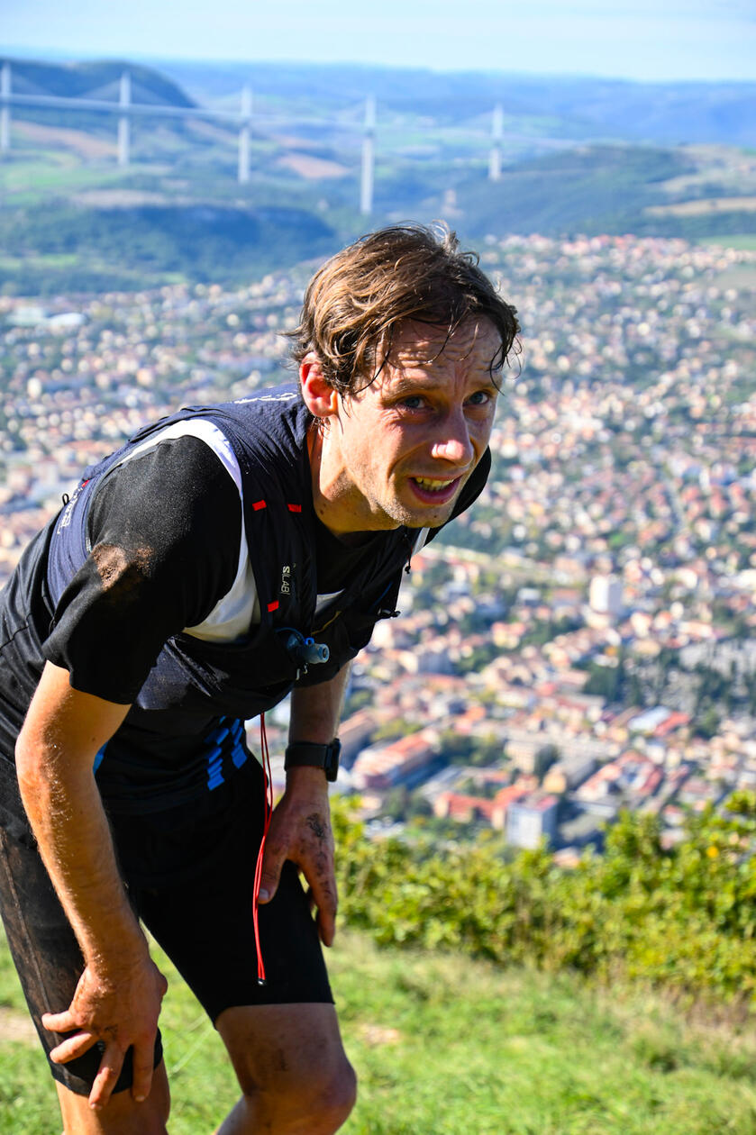Endurance Trail Running Photography in Southern France with Scenic Cityscape and Millau Viaduct in the Background