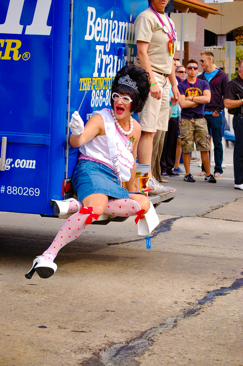 Colorful Street Photography Capturing Drag Performance and LGBTQ+ Pride Celebration During Urban Parade