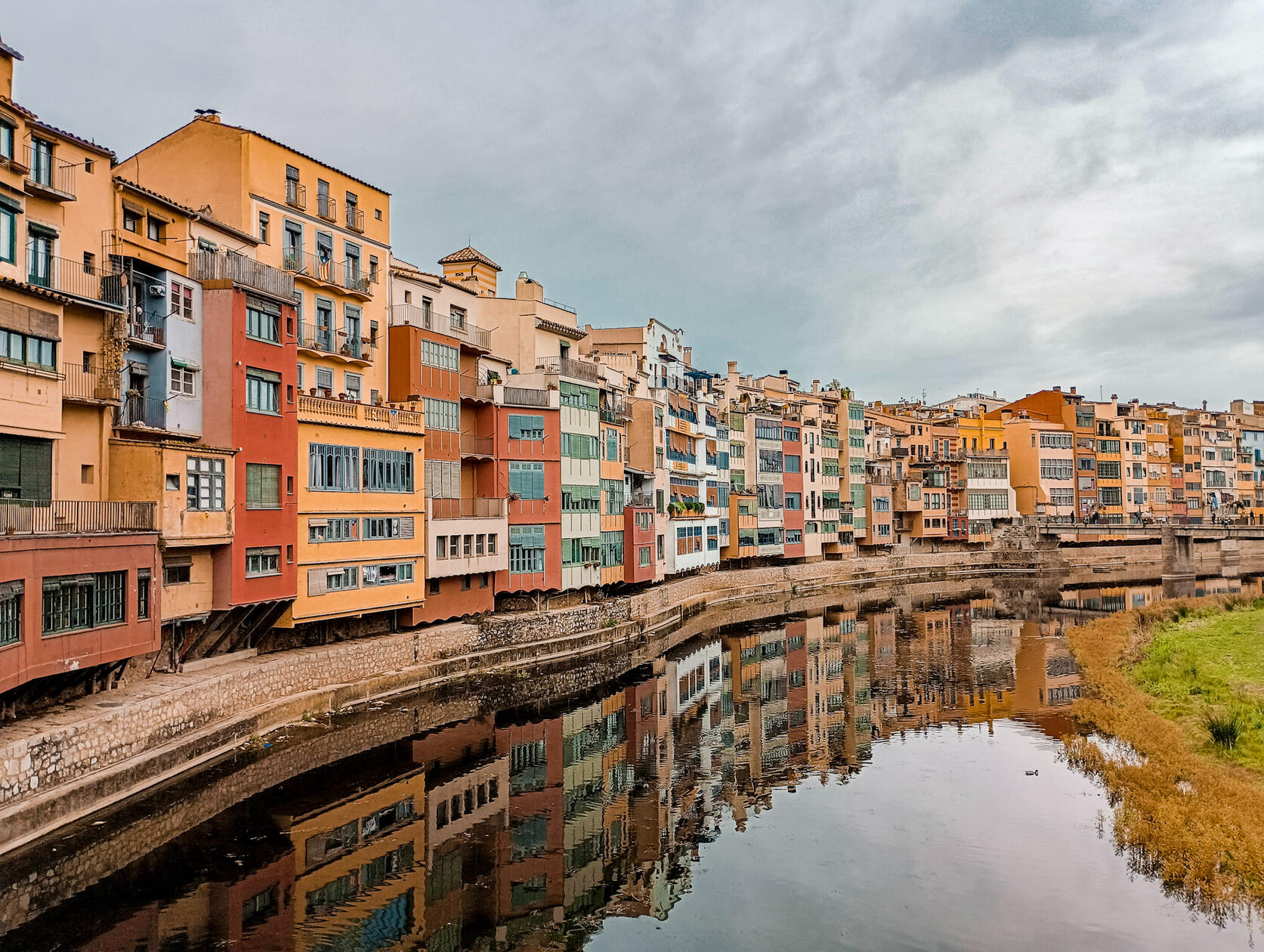 Colorful Riverside Architecture Photography of Girona, Spain with Reflections on the Onyar River