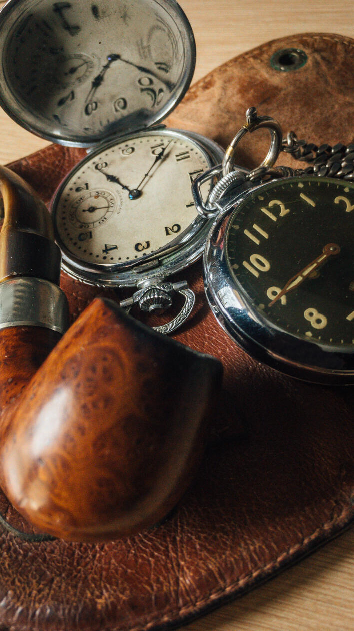 Vintage Still Life Photography Featuring Pocket Watches, Tobacco Pipe, and Leather Accessories — Timeless Elegance and Nostalgia
